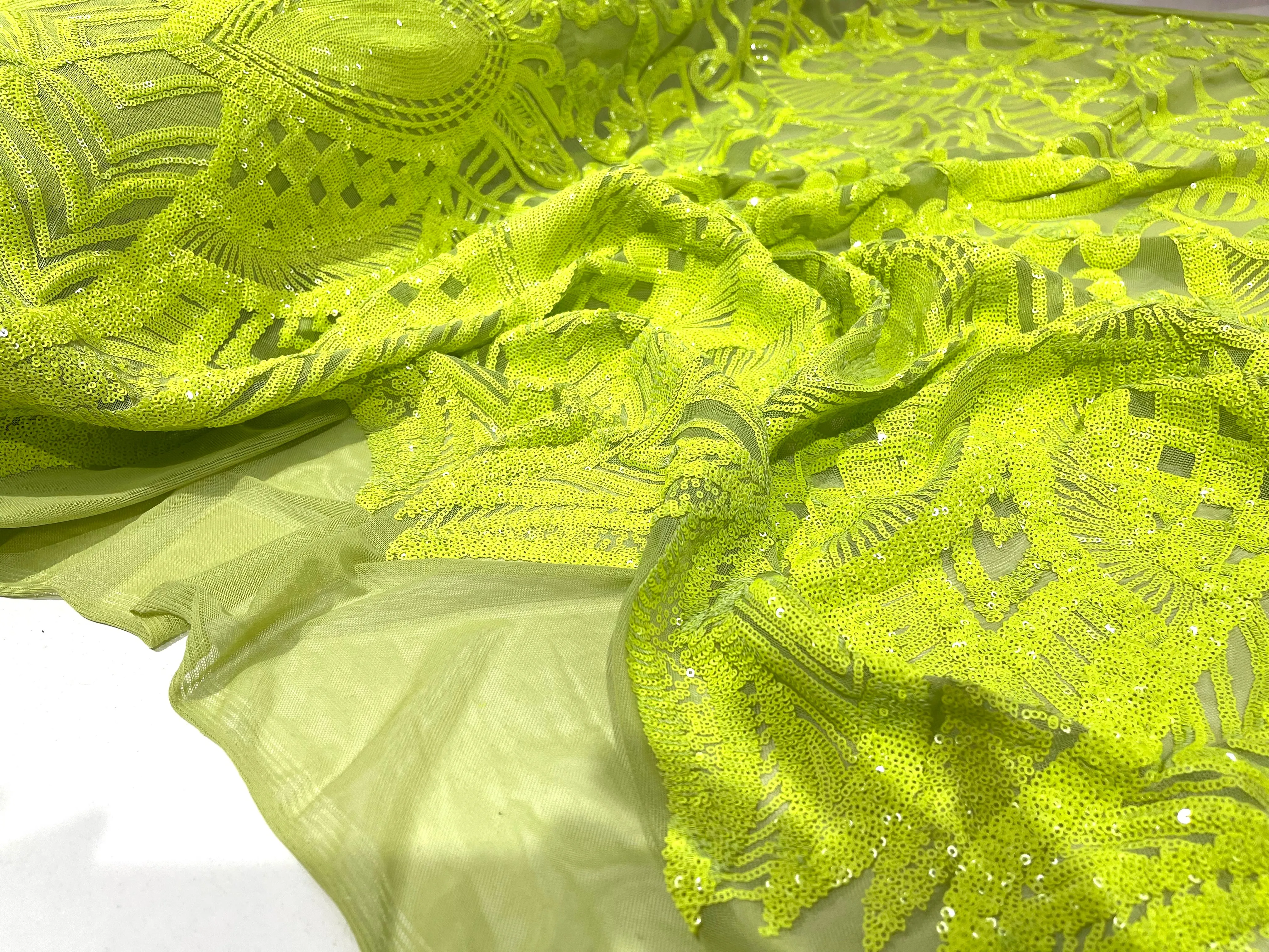 Neon Green iridescent royalty design on a green 4 way stretch mesh-prom-sold by the yard.